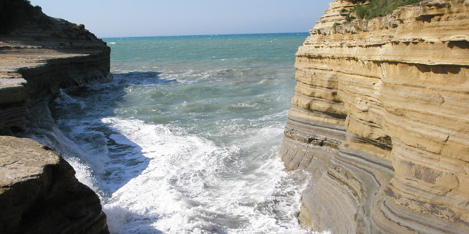 the canal d’amour in sidari is one of corfu’s most romantic spots, famous for its smooth rock formations and cozy coves
